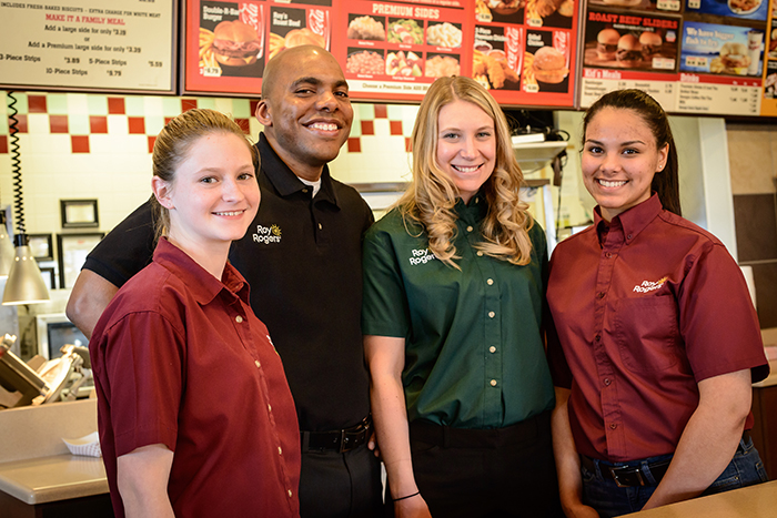 Roy Rogers team members with manager