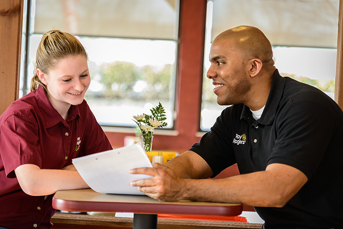 Team manager with staff member